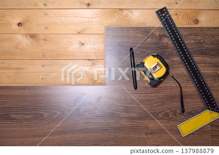 Precision Tools and Wooden Surfaces: A Close-Up of Measuring Equipment in Effective Craftsmanship Precision Tools and Wooden Surfaces: A Close-Up of Measuring Equipment in Effective Craftsmanship 137988879
