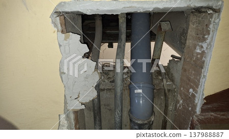 Plumbing renovation. Exposed wall pipe installation. Plumbing renovation. Exposed wall pipe installation. 137988887