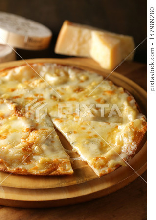 A close-up of delicious-looking pizza being served. 137989280