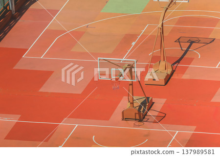 Sunlit Outdoor Basketball Court with Geometric Painted Surfaces March 14 2026 Sunlit Outdoor Basketball Court with Geometric Painted Surfaces March 14 2026 137989581
