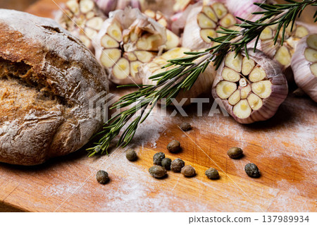 Fresh homemade bread. Italian ciabatta with rosemary, garlic, and capers Fresh homemade bread. Italian ciabatta with rosemary, garlic, and capers 137989934