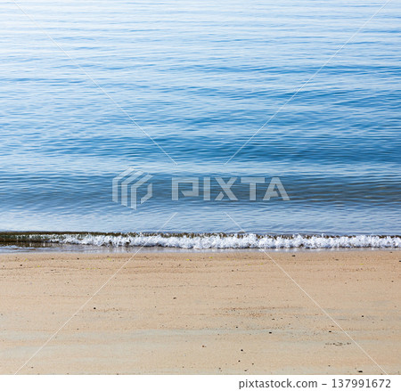 A simple scene of the calm spring sea at a beach on Shodoshima Island. A simple scene of the calm spring sea at a beach on Shodoshima Island. 137991672