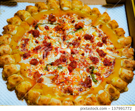 mexican Pizza with Melted Cheese and Crispy Crust on box 137991772