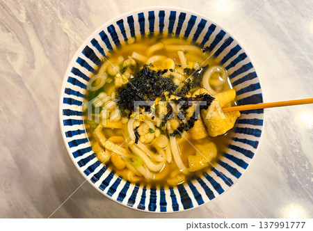 Udon noodle soup with assorted fish cakes in a bowl Udon noodle soup with assorted fish cakes in a bowl 137991777