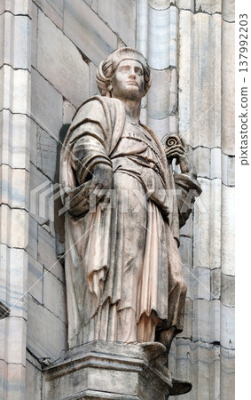 Statue of Saint on the facade of the Milan Cathedral, Duomo di Santa Maria Nascente, Milan, Lombardy, Italy Statue of Saint on the facade of the Milan Cathedral, Duomo di Santa Maria Nascente, Milan, Lombardy, Italy 137992203