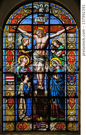 The Crucifixion by Lusson, central stained glass window in the Basilica of Notre Dame des Victoires in Paris, France The Crucifixion by Lusson, central stained glass window in the Basilica of Notre Dame des Victoires in Paris, France 137992391