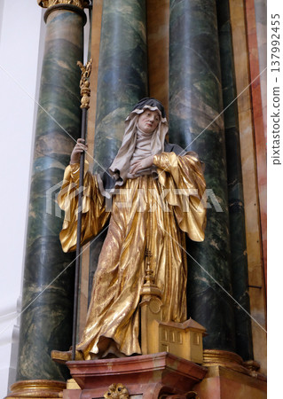 Statue of Saint, Altar in Collegiate church in Salzburg Statue of Saint, Altar in Collegiate church in Salzburg 137992455