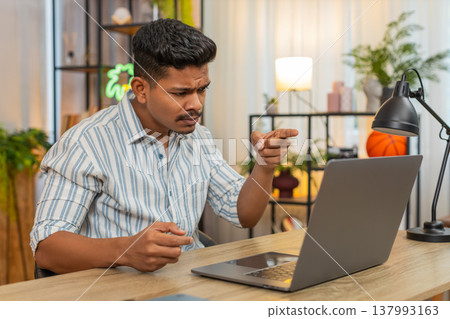Indian man on video conference argues about work raises voice pushes decision and clear next steps Indian man on video conference argues about work raises voice pushes decision and clear next steps 137993163