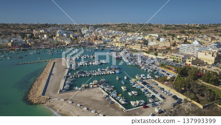 Malta: Aerial drone capturing the picturesque Marsaxlokk harbor in Malta. Drone flight Malta: Aerial drone capturing the picturesque Marsaxlokk harbor in Malta. Drone flight 137993399