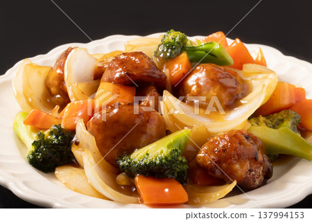 Meatballs in sweet and sour sauce 137994153