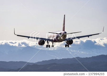 Sendai Airport at dusk, with a blue sky and a plane landing. Natori City, Miyagi Prefecture. 137994203