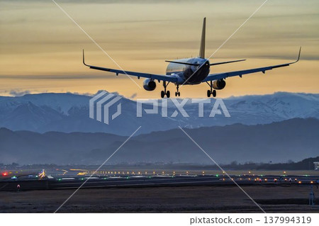 Sendai Airport at dusk, airplane landing, Natori City, Miyagi Prefecture Sendai Airport at dusk, airplane landing, Natori City, Miyagi Prefecture 137994319