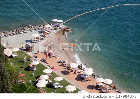 Tourists enjoy the beach in Portoroz, Slovenia 137994375