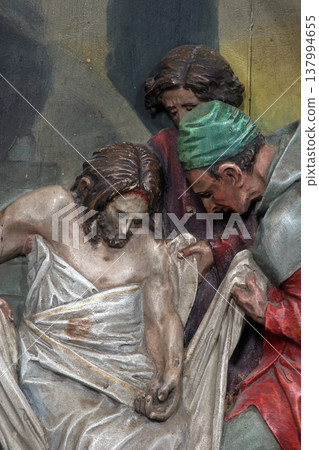 Jesus is laid in the tomb and covered in incense 137994655