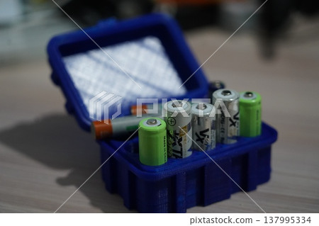 Batteries in a Blue 3D Printed Storage Box Container Batteries in a Blue 3D Printed Storage Box Container 137995334