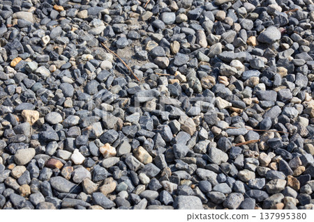 Ground covered with crushed stone Ground covered with crushed stone 137995380