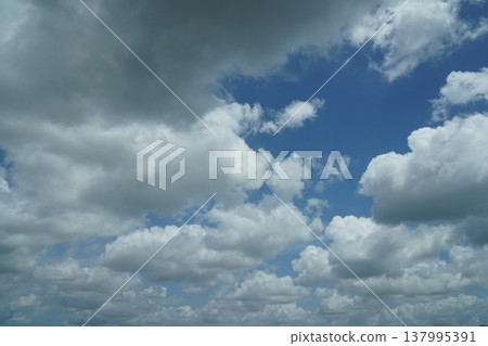 Blue Sky Filled with White Clouds on a Summer Day Blue Sky Filled with White Clouds on a Summer Day 137995391