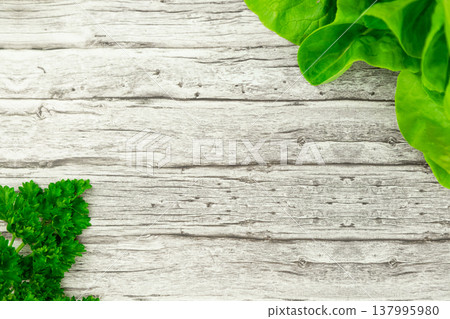 Rustic wooden food background with fresh herbs and greens Rustic wooden food background with fresh herbs and greens 137995980