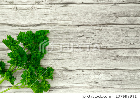 Herbs and black pepper on the table. View from above. Dill, parsley and peppercorns. Recipe for cooking 137995981