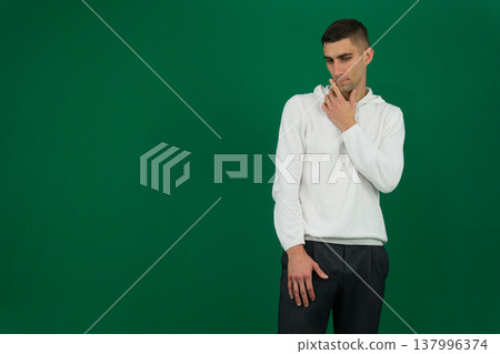 Serious, pensive bearded man sitting in cozy living room looking away, middle aged male thinking. Planning strategy concept 137996374