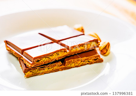 Dubai chocolate is a trendy chocolate. [Image of Dubai chocolate] 137996381
