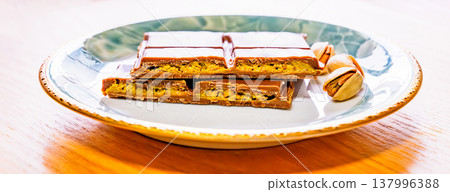 Dubai chocolate is a trendy chocolate. [Image of Dubai chocolate] 137996388
