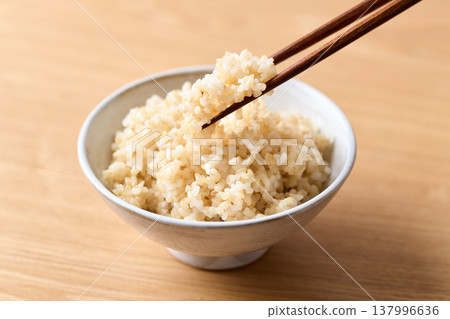 Brown rice served in a bowl Brown rice served in a bowl 137996636