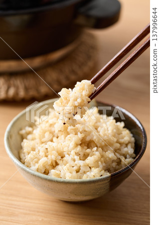 Brown rice served in a bowl Brown rice served in a bowl 137996644