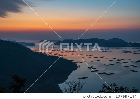 A beautiful landscape floating on the sea at dawn in Sakomon, Setouchi City, Okayama Prefecture, Japan. 137997184