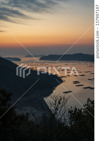A beautiful landscape floating on the sea at dawn in Sakomon, Setouchi City, Okayama Prefecture, Japan. 137997187