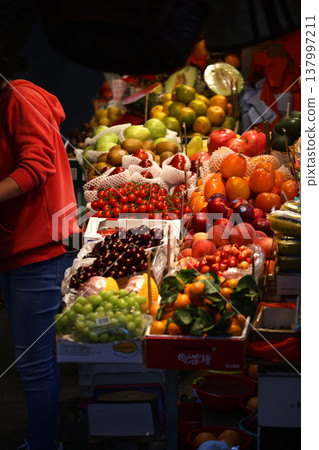 Fruits such as oranges sold at the open-air market. Most of them are imported. Fruits such as oranges sold at the open-air market. Most of them are imported. 137997211