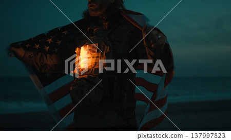 Memorial Day Of An American Soldier At Night With The Flag Behind Him Memorial Day Of An American Soldier At Night With The Flag Behind Him 137997823