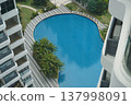 Luxury Condo Swimming Pool Aerial View of Palm Trees 137998091
