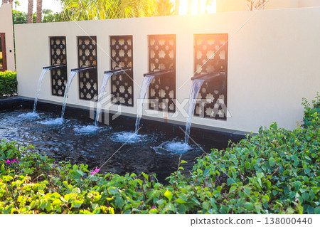 A composition of mini waterfalls at the entrance to the hotel A composition of mini waterfalls at the entrance to the hotel 138000440