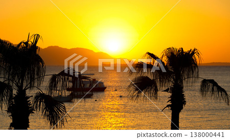 Seascape - the sun rises over the island early in the morning 138000441