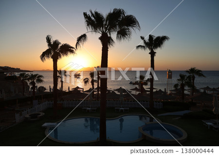 Seascape - the sun rises over the island early in the morning 138000444