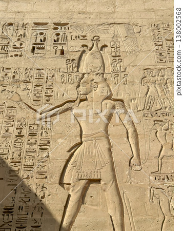 Beautiful bas-reliefs and ancient hieroglyphs from the mortuary temple of Ramesses III at Medinet Habu, Luxor, Egypt. Beautiful bas-reliefs and ancient hieroglyphs from the mortuary temple of Ramesses III at Medinet Habu, Luxor, Egypt. 138002568