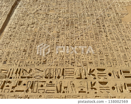 Beautiful bas-reliefs and ancient hieroglyphs from the mortuary temple of Ramesses III at Medinet Habu, Luxor, Egypt. 138002569