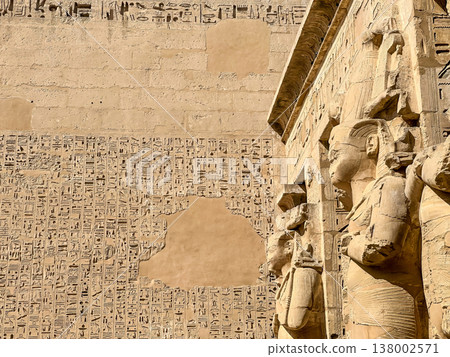 Beautiful bas-reliefs and ancient hieroglyphs from the mortuary temple of Ramesses III at Medinet Habu, Luxor, Egypt. Beautiful bas-reliefs and ancient hieroglyphs from the mortuary temple of Ramesses III at Medinet Habu, Luxor, Egypt. 138002571