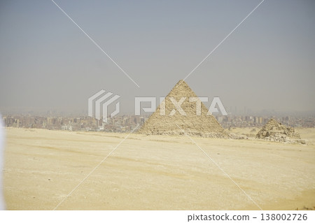 The Great Pyramid of Giza with Cairo City Skyline in the Distant Background 138002726