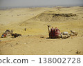 Dromedary Camel Resting on Sand with Giza Pyramids in Background, Egypt Travel Concept 138002728