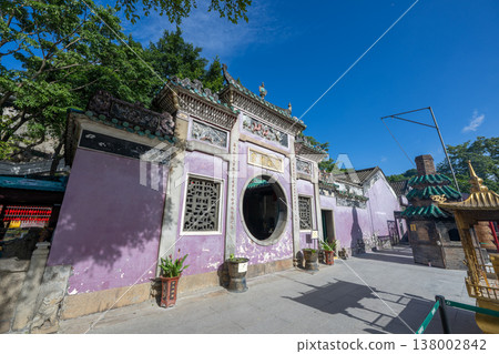 Macau World Heritage Site: Ama Temple, the circular gate and purple exterior walls of the Hongren Hall. Macau World Heritage Site: Ama Temple, the circular gate and purple exterior walls of the Hongren Hall. 138002842