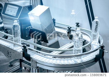 The hi-technology of drinking water manufacturing process. The empty drinking water bottles on the conveyor belt for filling process. The hi-technology of drinking water manufacturing process. The empty drinking water bottles on the conveyor belt for filling process. 138003671