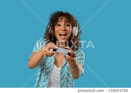 Young African Gamer Teenage Playing Online Video Game On Console With Joystick Young African Gamer Teenage Playing Online Video Game On Console With Joystick 138003700