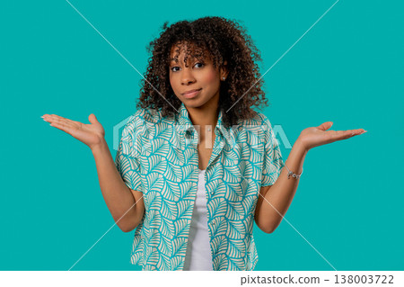 Confused African Teen Girl Shrugs Shoulders. Uncertainty, Confusion,Hesitation 138003722