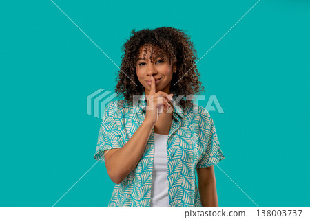 African Teen girl Makes Shush Shh Gesture With Finger On Lips, Silence Signaling African Teen girl Makes Shush Shh Gesture With Finger On Lips, Silence Signaling 138003737