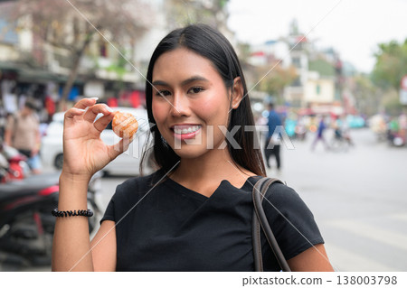 Asian Woman Holding Vietnamese Street Dessert in Hanoi Vietnam 138003798