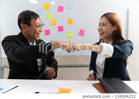businessman and businesswoman Congratulating fit bump businessman and businesswoman Congratulating fit bump 138004222