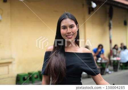 Young Thai Woman in Black Dress on Hanoi Street Young Thai Woman in Black Dress on Hanoi Street 138004285