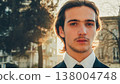 Young confident businessman looking to the camera, outdoors. Portrait of the Handsome White man with brown hair,  in the city, on summer. Stylish man in business suit, on the street. People lifestyle 138004748